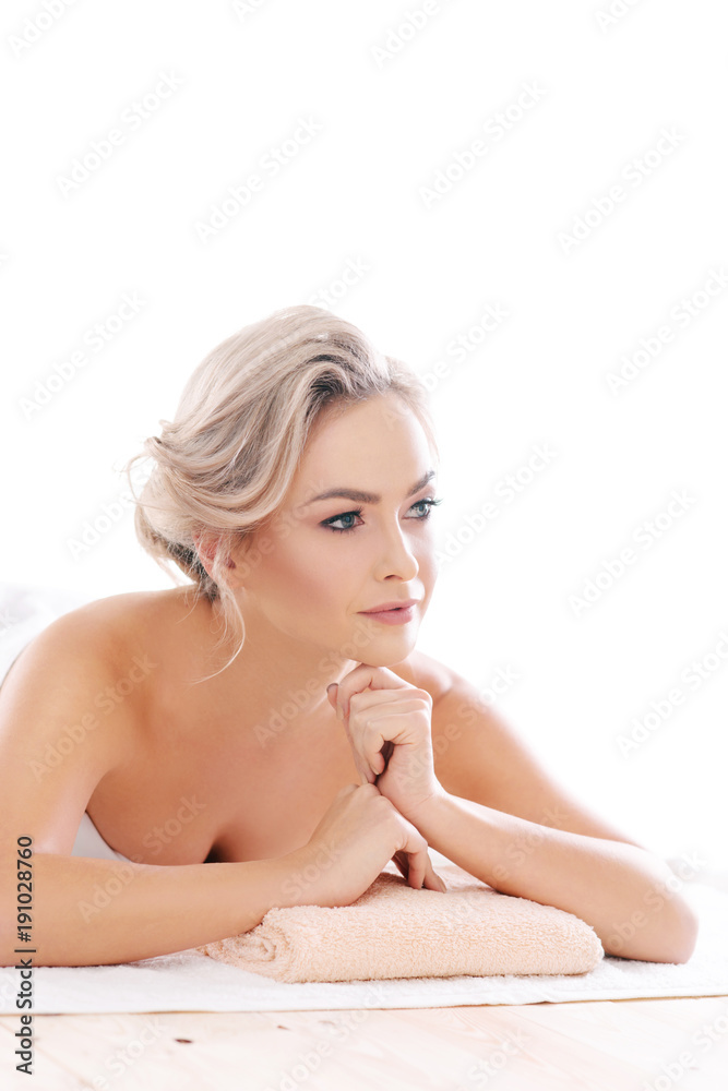 Obraz premium Young, beautiful and healthy girl relaxing in spa salon. Rejuvenation therapy and massaging treatments. Recreation concept.
