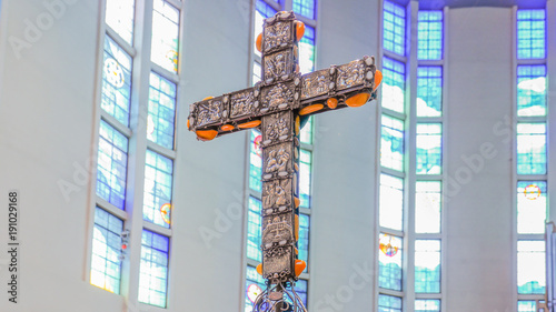 brown cross with amber inside the church