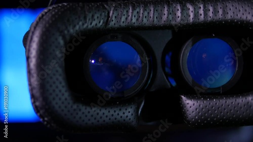 Virtual Reality glasses close up with blurred cororful VR background animation photo