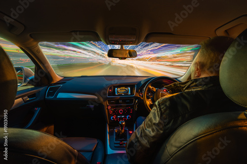 Car Interior Light Trails at Night / Multiple light trails creating dynamic action from the interior of a car at night