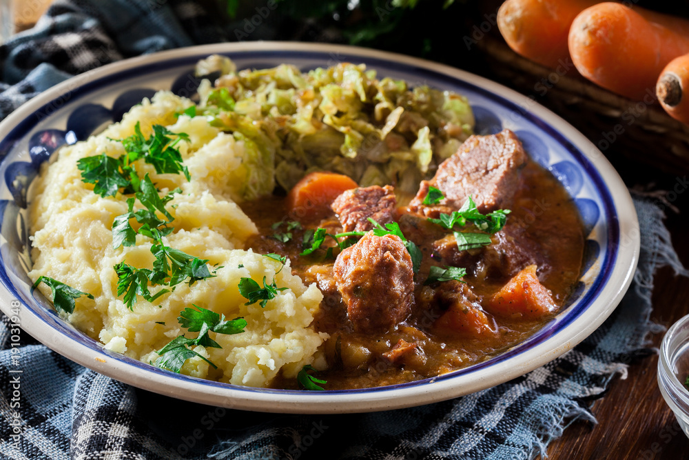 Traditional irish stew served with potatoes and cabbage