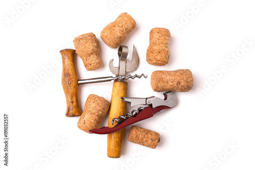 Opener, corkscrews and wine cork isolated on white background photo