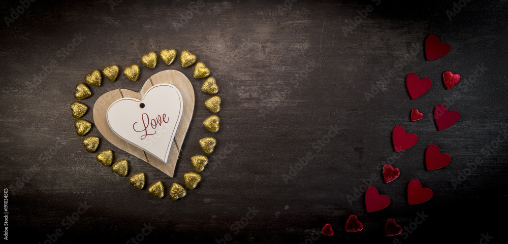 Obraz premium Happy valentine day hearts on wooden background