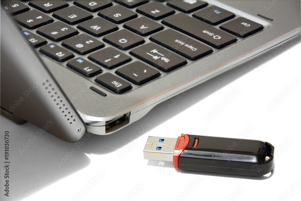 usb flash drive and laptop socket isolated on white background usb flash drive and laptop socket isolated on white background