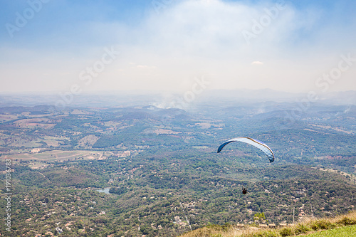 Belo Horizonte, Minas Gerais, Brazil. Paraglider flying from top of the world mountain