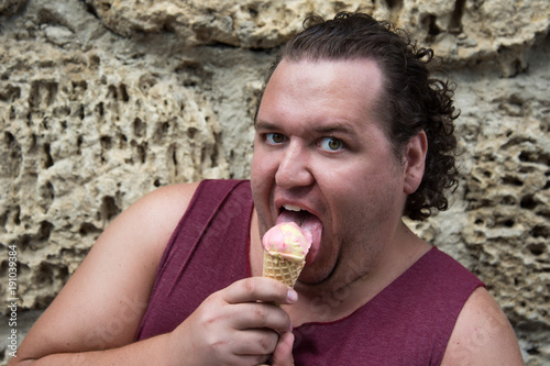 Vacation. Summer and ice cream. Funny fat guy.  photo