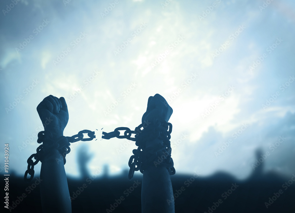 Individual human right day concept: Silhouette human hands raising and broken chains at night background. - obrazy, fototapety, plakaty 