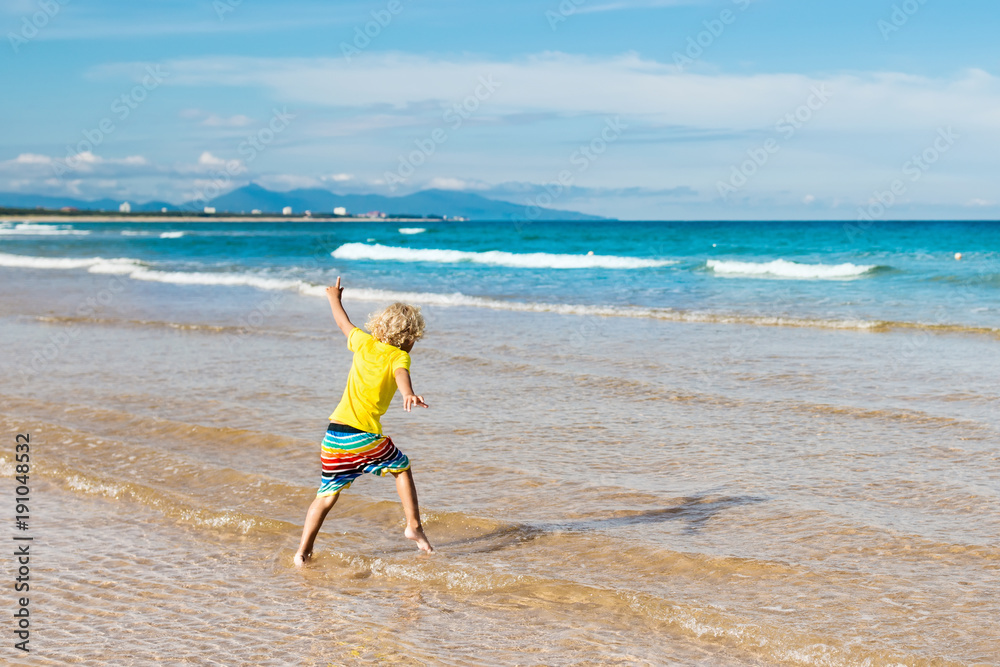 Child on tropical beach. Sea vacation with kids. Child on tropical beach. Sea vacation with kids.