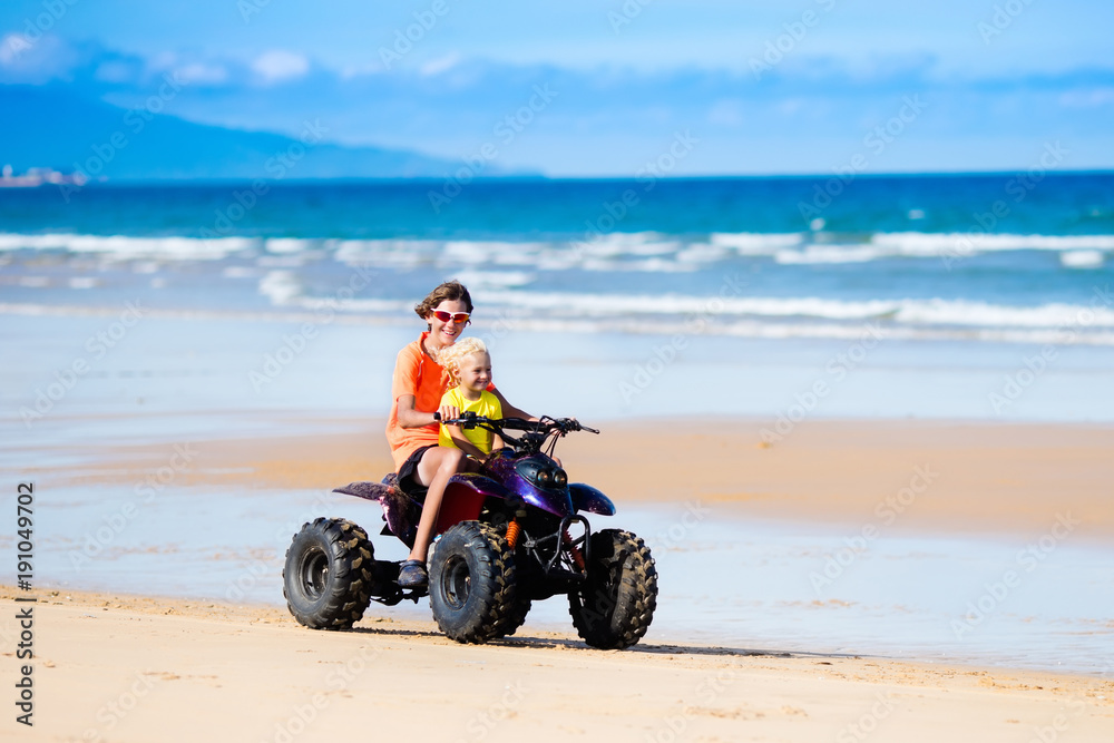 Kids on quad bike. Off road all terrain vehicle. Kids on quad bike. Off road all terrain vehicle.