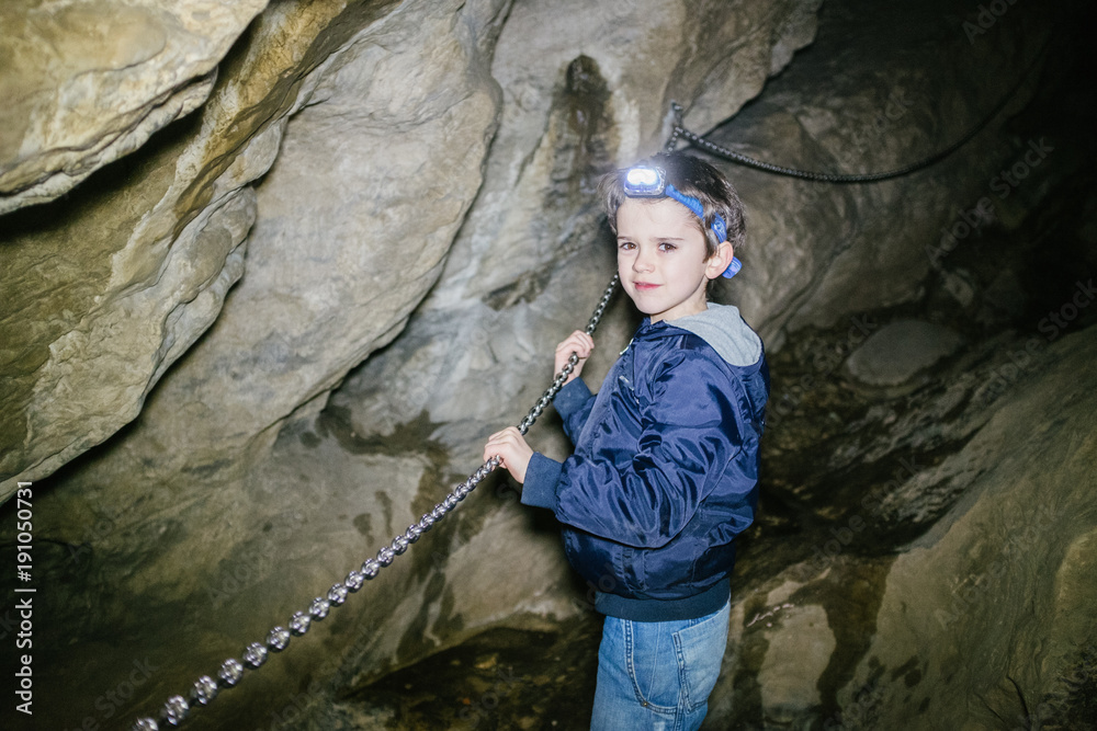 Children explore underground cavern