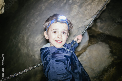 Children explore underground cavern