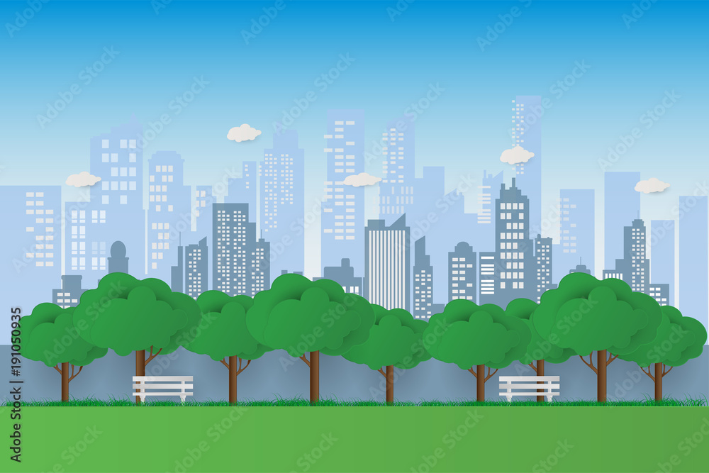 Nature in a beautiful urban park. City park bench with green tree and town buildings background. exercise and relax