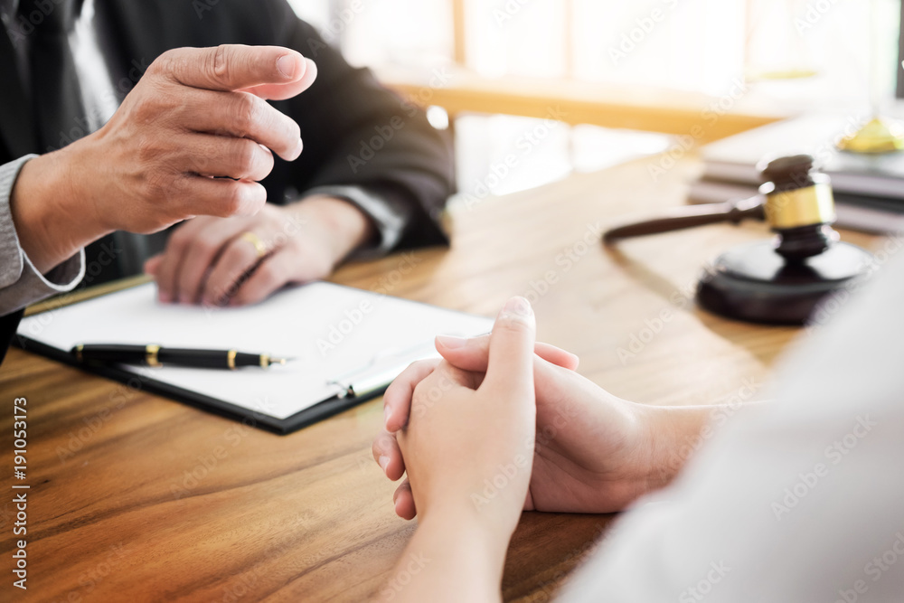 Fototapeta premium business people and lawyers discussing contract papers sitting at the table. Concepts of law, advice, legal services