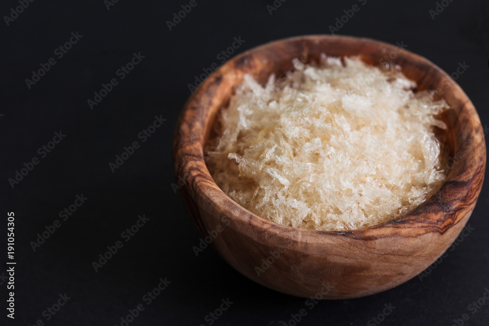 The gellant agent agar-agar seaweed in wooden bowl copy space The gellant agent agar-agar seaweed in wooden bowl copy space