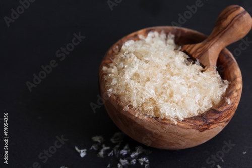 The gellant agent agar-agar seaweed in wooden bowl copy space