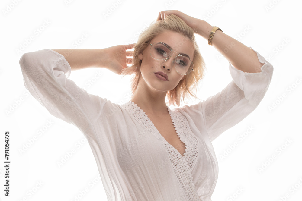 Naklejka premium Attractive blonde young lady all in white.