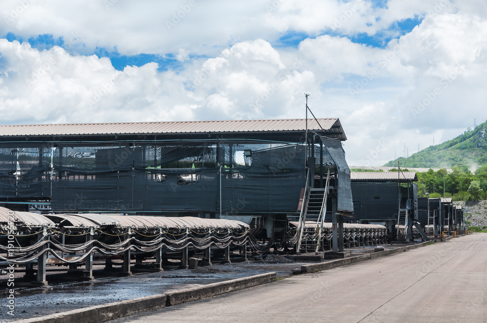 Naklejka premium Outdoor incline large conveyor with rubber belt conveyor for transportation line for processing the coal in the coal mine.