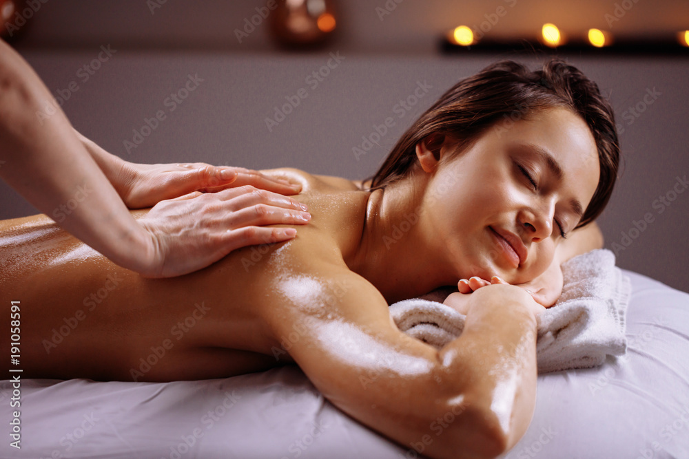 Man getting massage in spa 910660 Stock Photo at Vecteezy