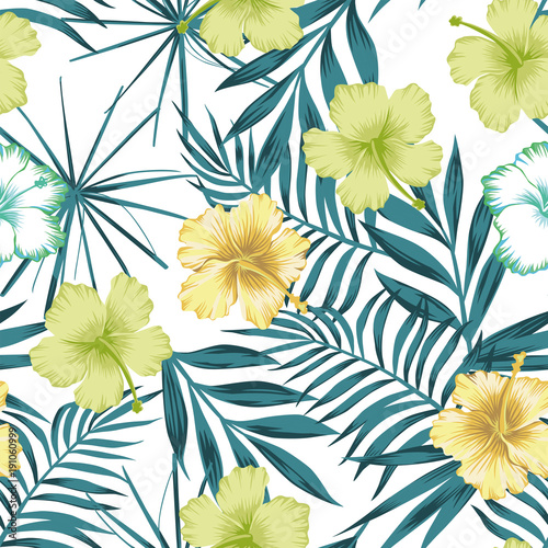Lime green hibiscus on the blue leaves seamless background