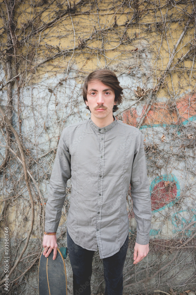 Obraz premium Young handsome caucasian man with moustache