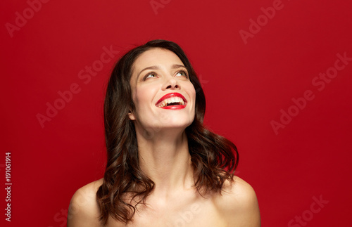 beautiful smiling young woman with red lipstick