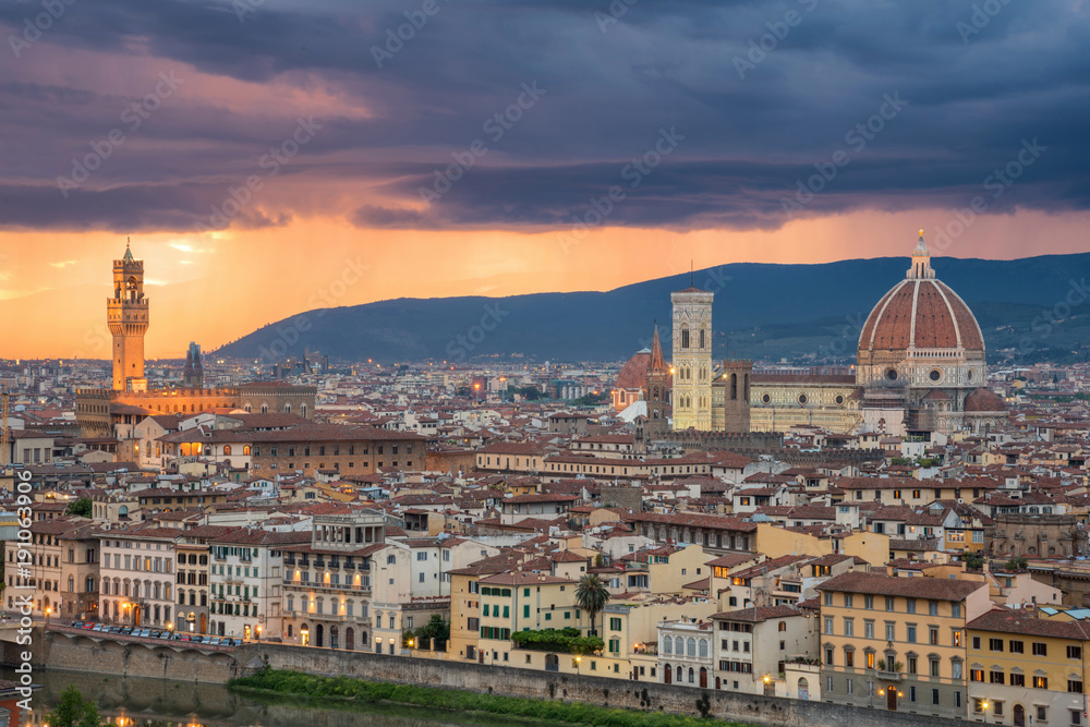 Beautiful sunset and rain thunder storm over Cathedral of Santa Maria del Fiore (Duomo) and Vecchio palazzo, Florence, Italy