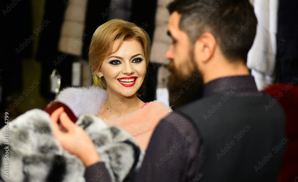 Fashion and shopping concept. Shop assistant with beard Fashion and shopping concept. Shop assistant with beard