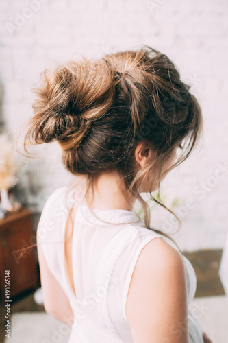A woman's hairdo. Hairstyle of the bride.