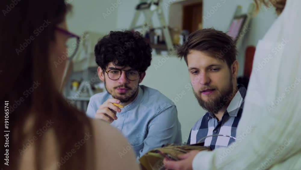 Group of young people working together in an office. Group of young people working together in an office.