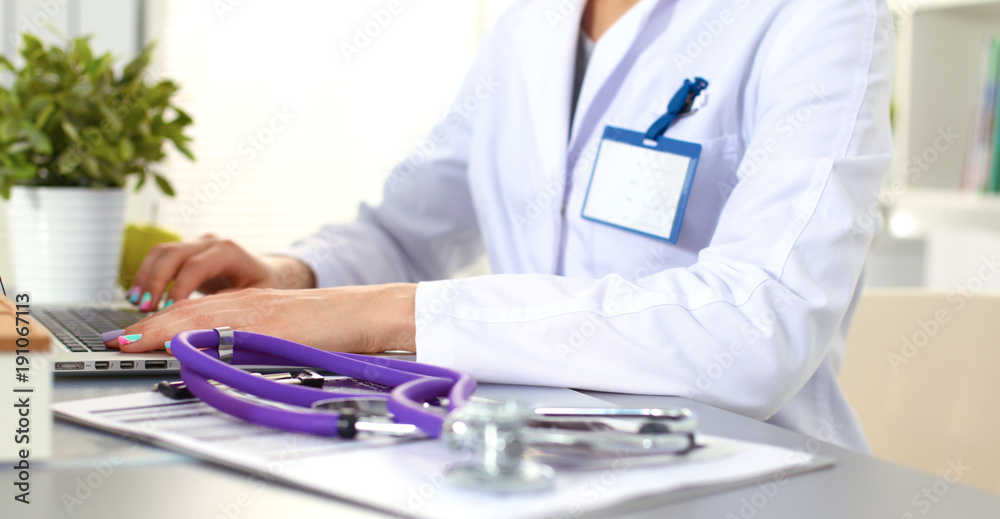 Female doctor at the office of the table Female doctor at the office of the table
