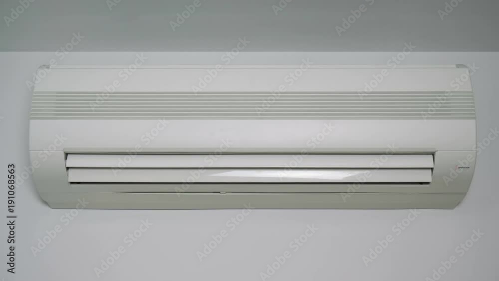 Front view at an operating air conditioner. (loop ready video) Front view at an operating air conditioner. (loop ready video)