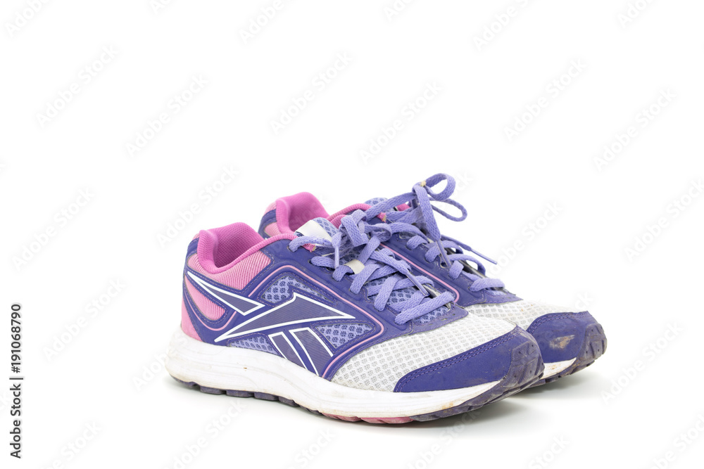 Purple female sport shoes isolated on white Purple female sport shoes isolated on white