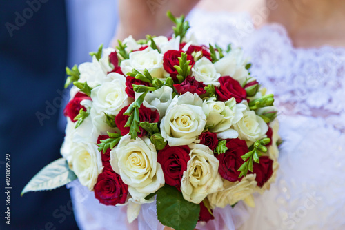 Three girls are holding three wedding bouquets. Wedding bouquets.