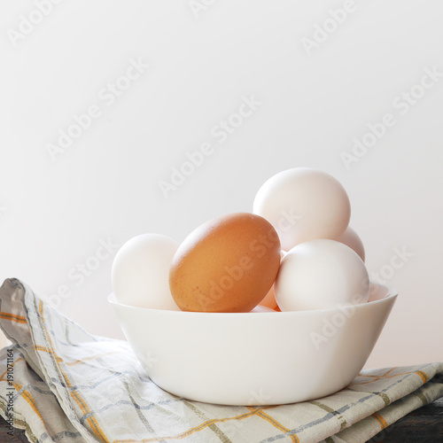Easter eggs in a cup on a white background.