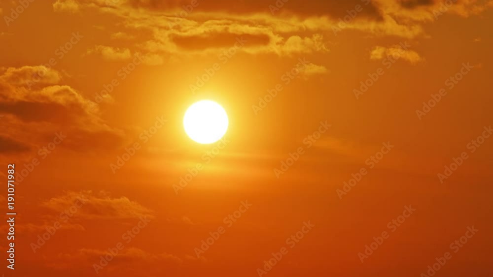 Beautiful time lapse of the sun setting behind the clouds. Beautiful time lapse of the sun setting behind the clouds.