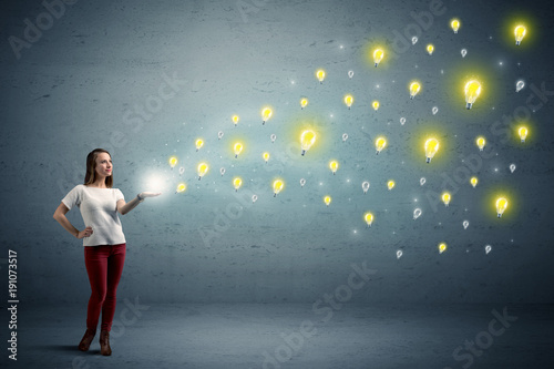 Woman holding lightbulbs