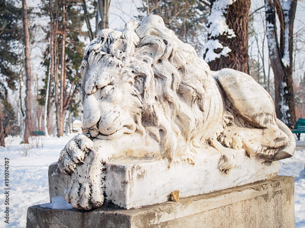 Amazing marble sculpture of a lying sleeping lion in the Chisinau (Moldova) Central Park.