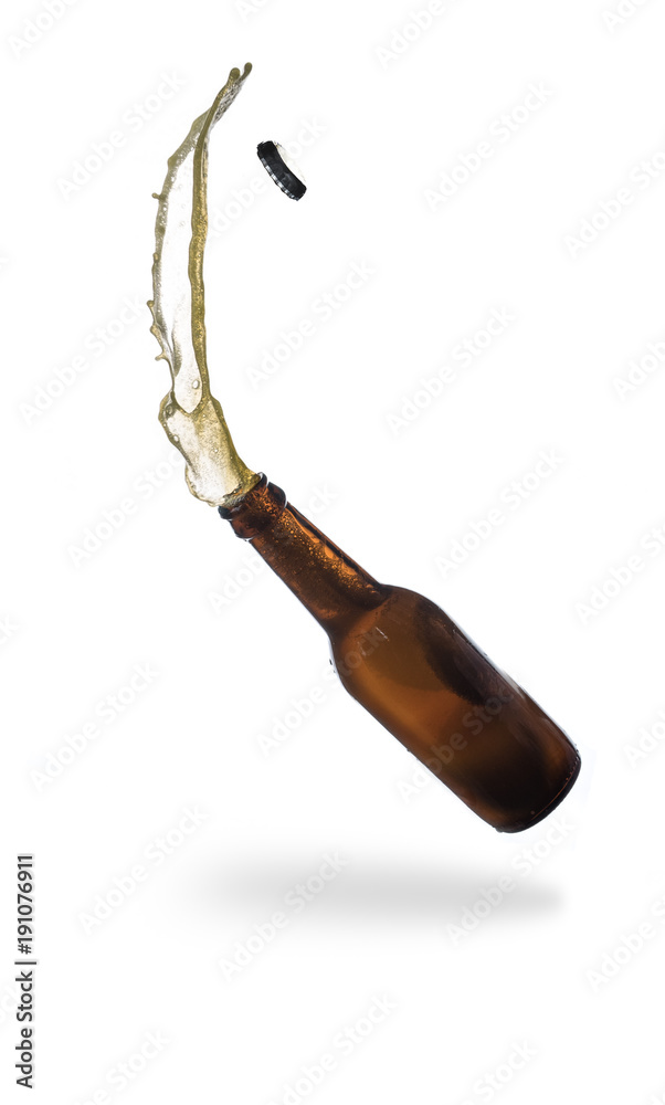 Gold beer bottle opening with exploding and splashing isolated on white ...