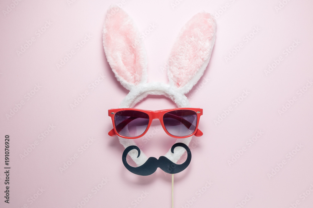 High angle view of accessory costume bunny ears, sunglasses and mustache paper props High angle view of accessory costume bunny ears, sunglasses and mustache paper props