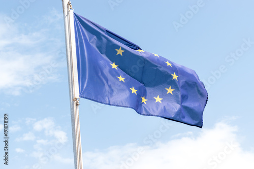 European Union flag on blue sky background