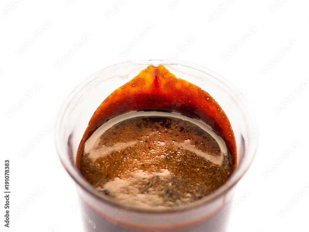 Black treacle or molasses on beaker. Molasses is the final product from ...