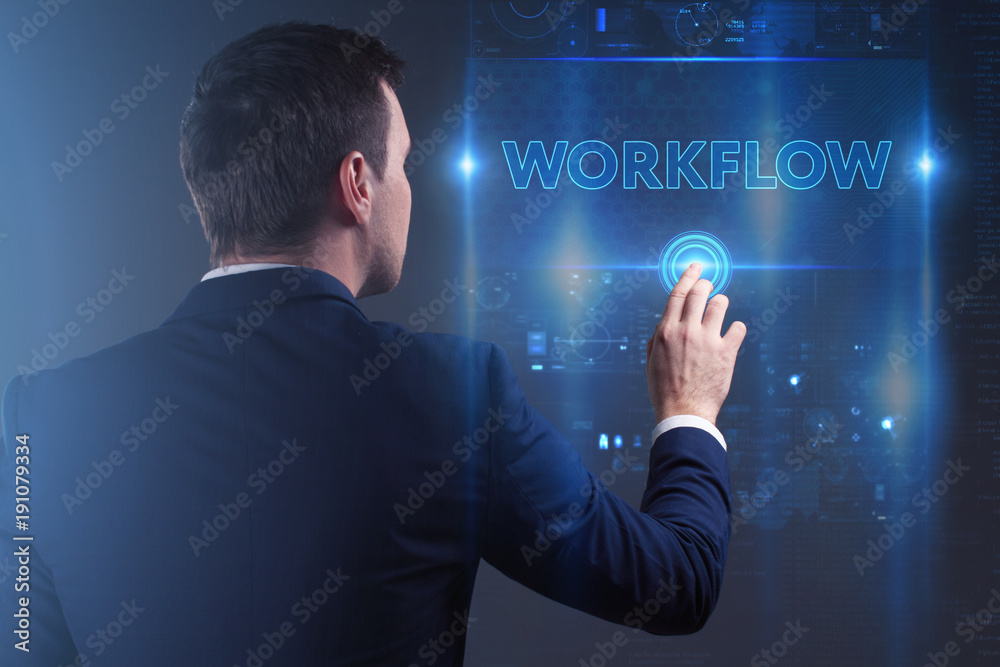 Business, Technology, Internet and network concept. Young businessman working on a virtual screen of the future and sees the inscription: Workflow Business, Technology, Internet and network concept. Young businessman working on a virtual screen of the future and sees the inscription: Workflow