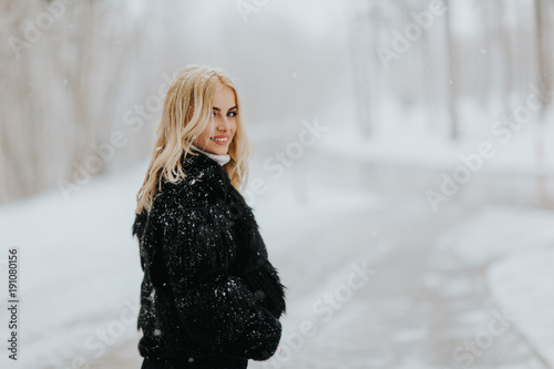 Pretty young blonde woman a...