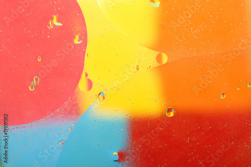 Abstract oil and water on a colored background