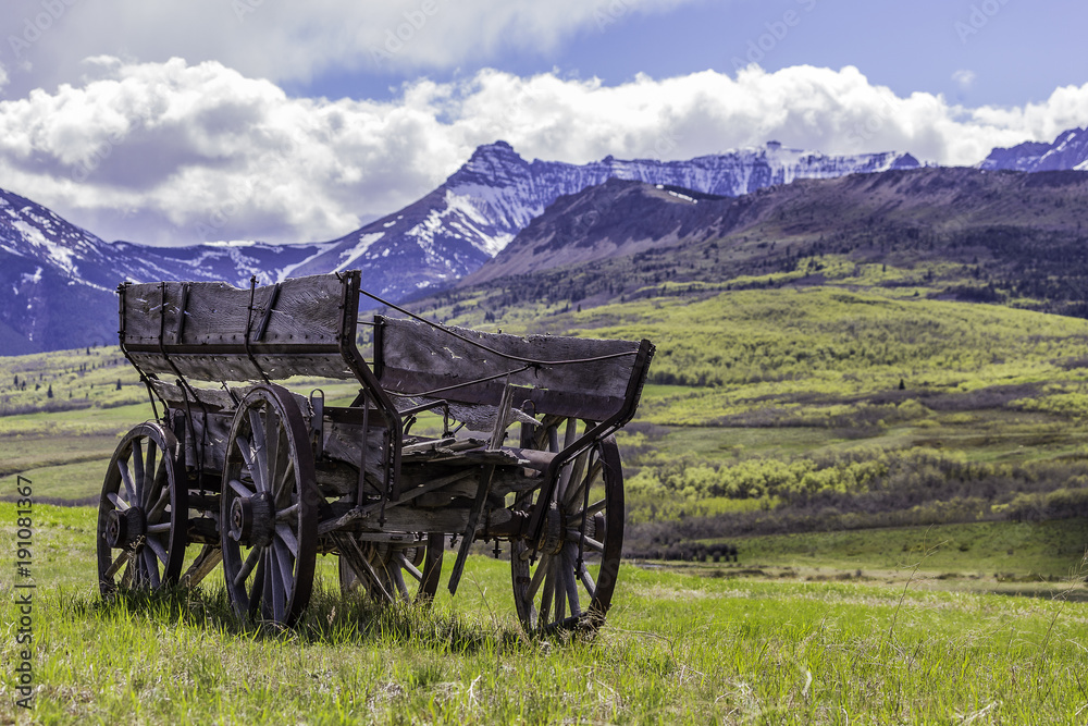 Abandoned Wagon against the Rocky Mountains