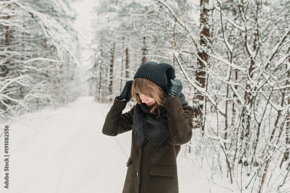 Cheerful woman in winter forest Cheerful woman in winter forest