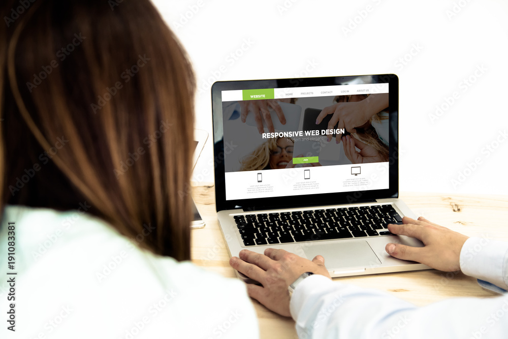 man and woman designing a website on laptop man and woman designing a website on laptop