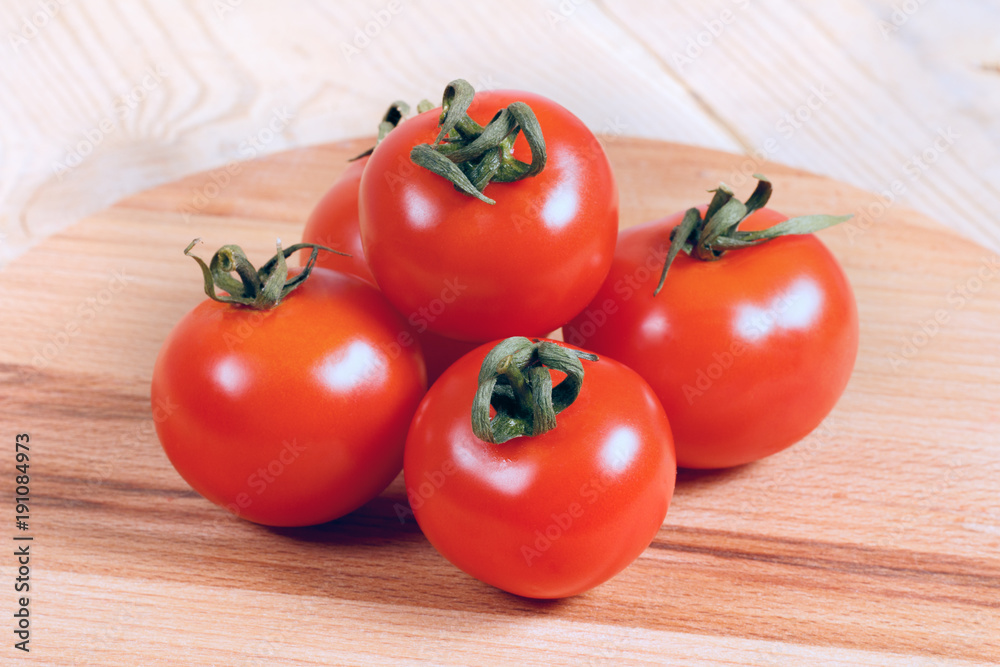 ripe red tomatoes on a wooden table ripe red tomatoes on a wooden table