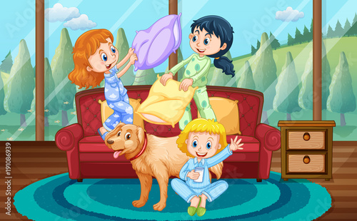 Girls playing pillow fight with friends at home
