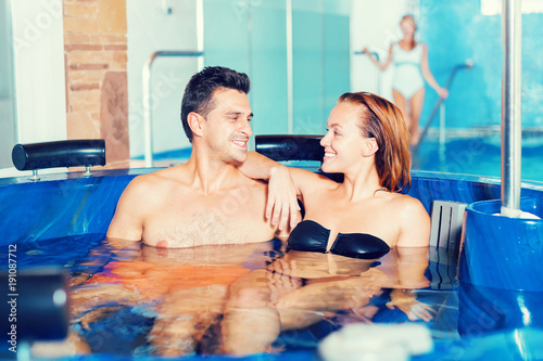 Couple in pool in spa salon © JackF